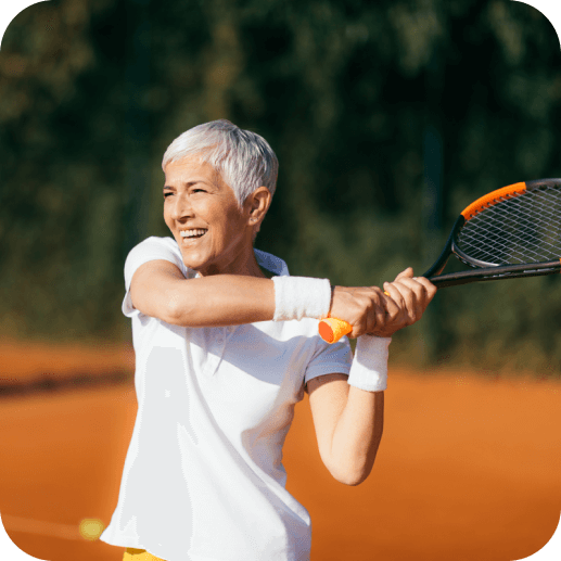 A woman playing tennis in a happy mood