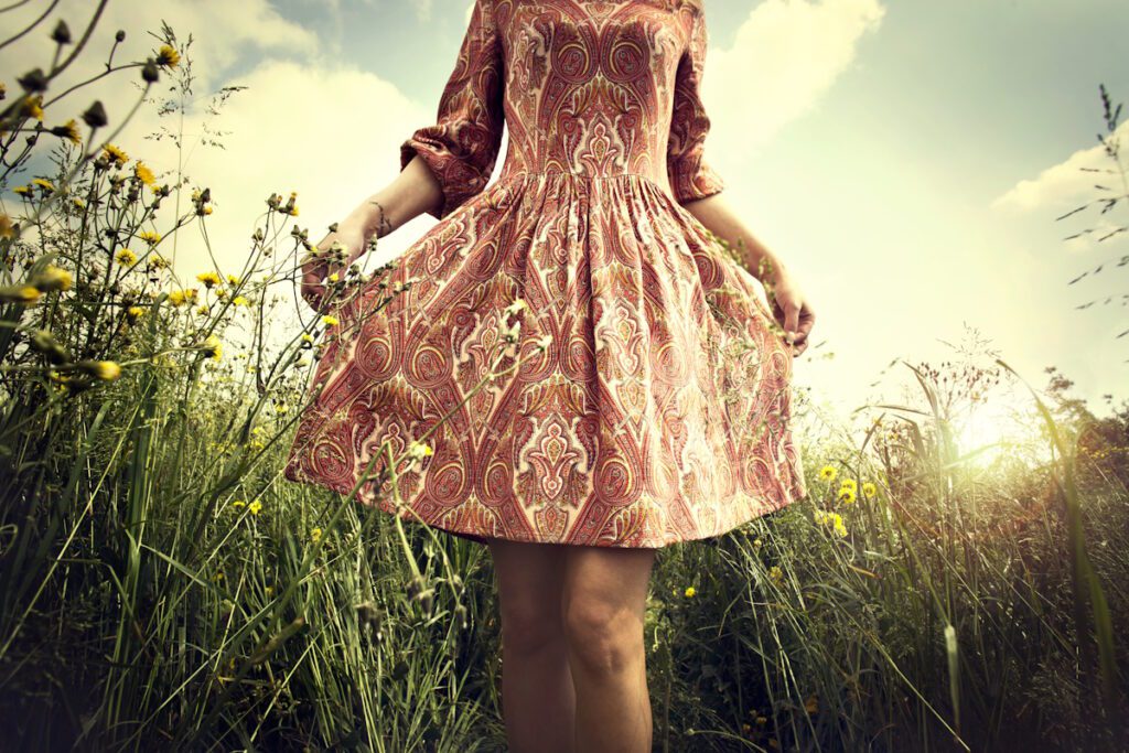 carefree woman walking in the meadow