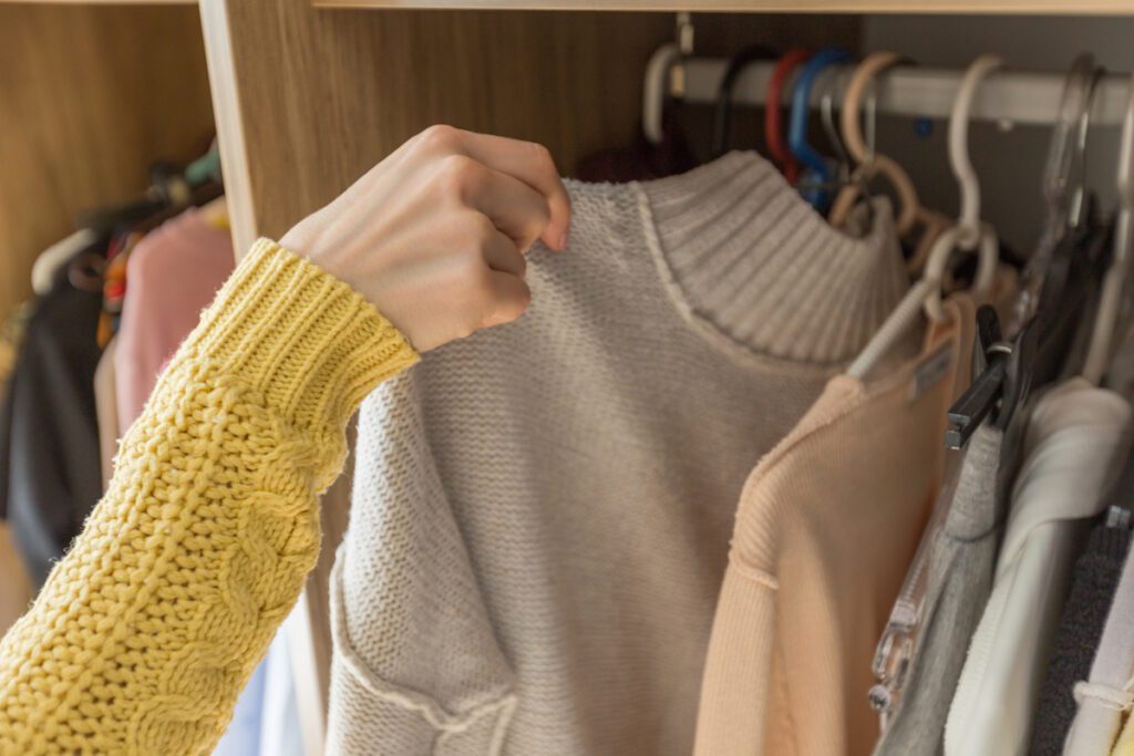 Woman's Hands Selecting Clothes