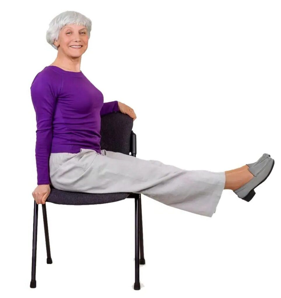 An elderly woman performing leg extensions to improve leg circulation.