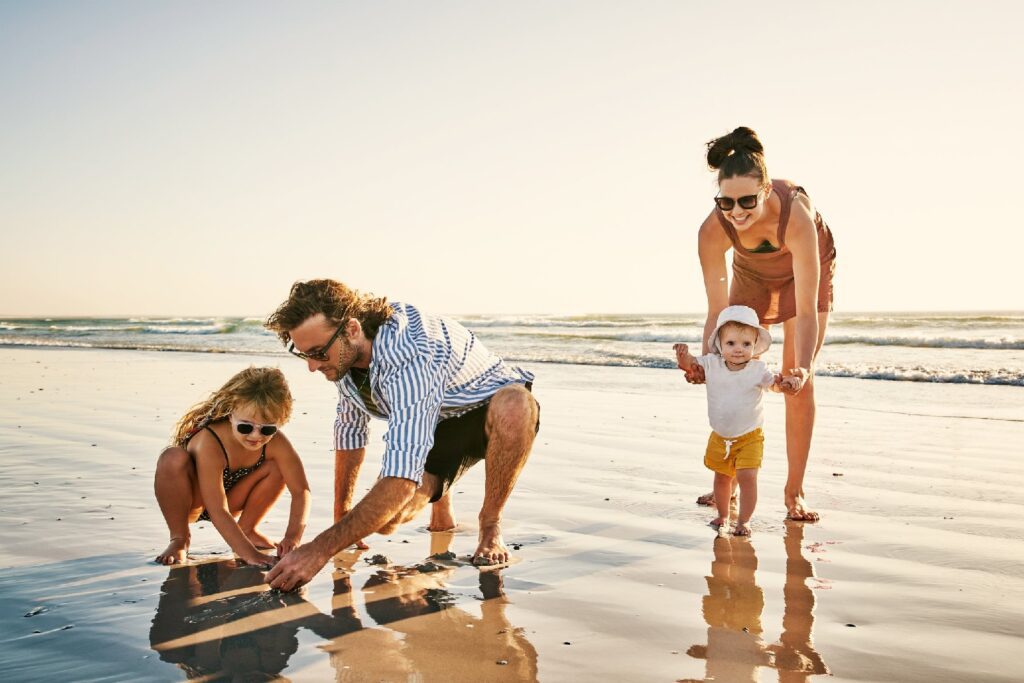 Family enjoying the beach despite leg pain