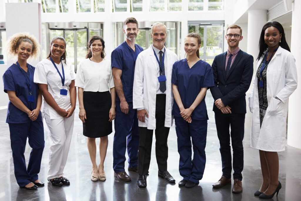 Portrait of medical staff posing in the hospital lobby for Stridecare