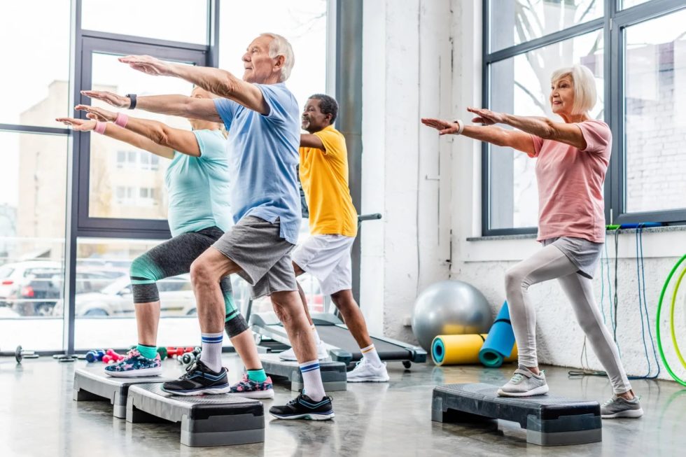 Seniors exercising at the gym to manage hereditary varicose veins