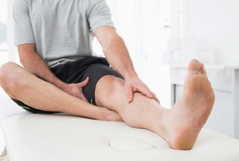 A man undergoing a leg examination for hereditary varicose veins.