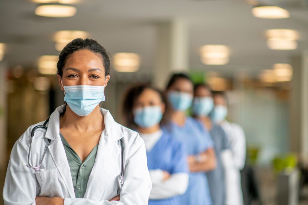 Five young female doctors in healthcare, including a vascular specialist.