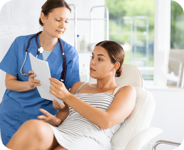 Woman doctor gives patient sitting in chair