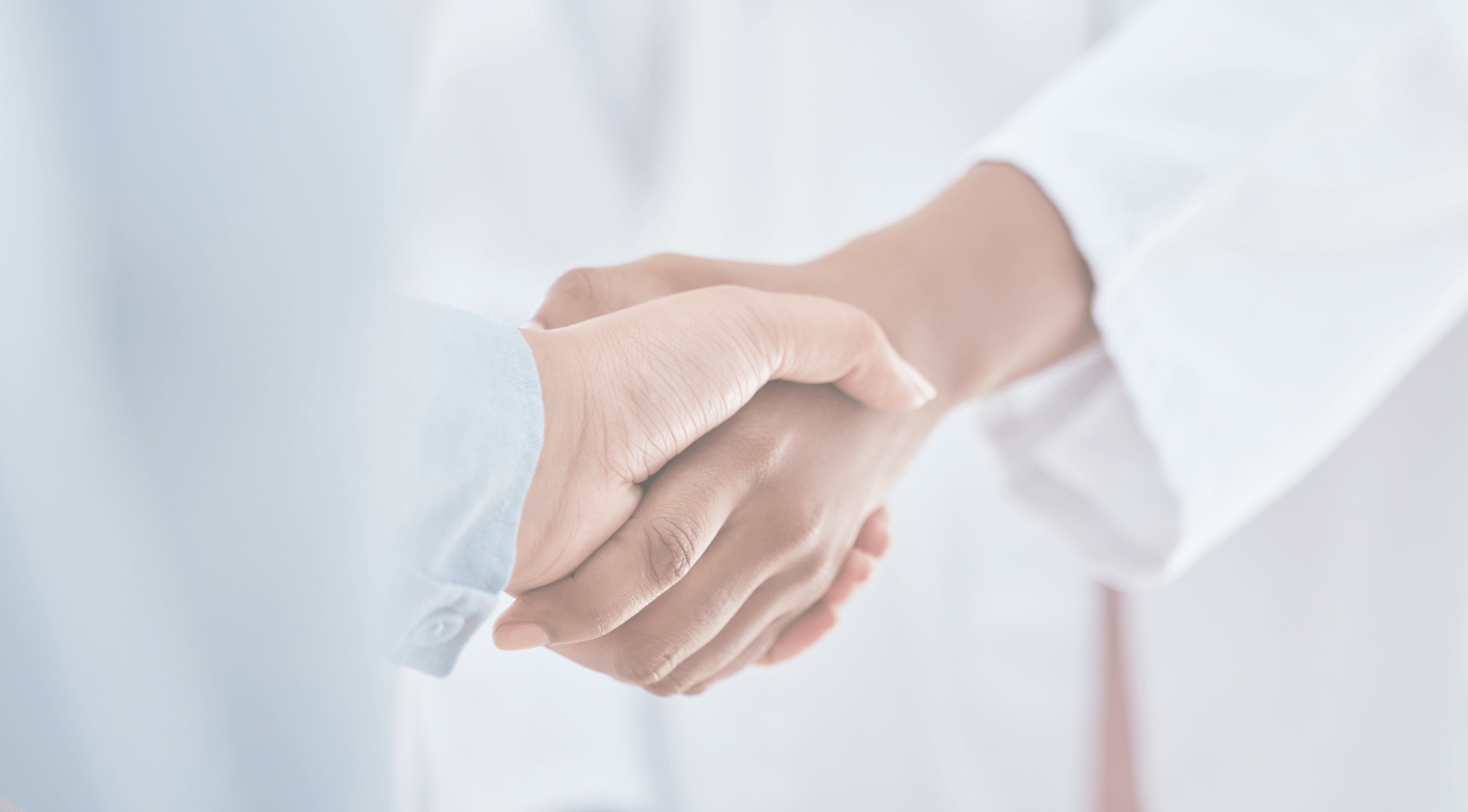 Patient shaking hands with the doctor with a sense of hope